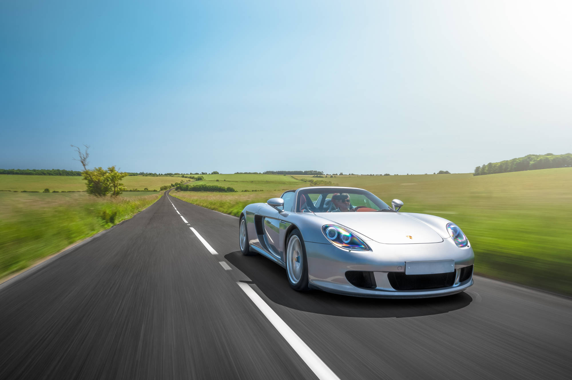 Silver Carrera GT on a country road