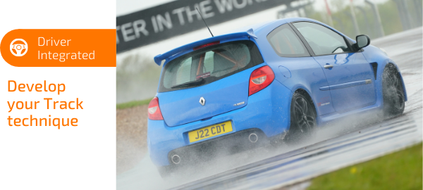 Blue renault clio on wet donington park track