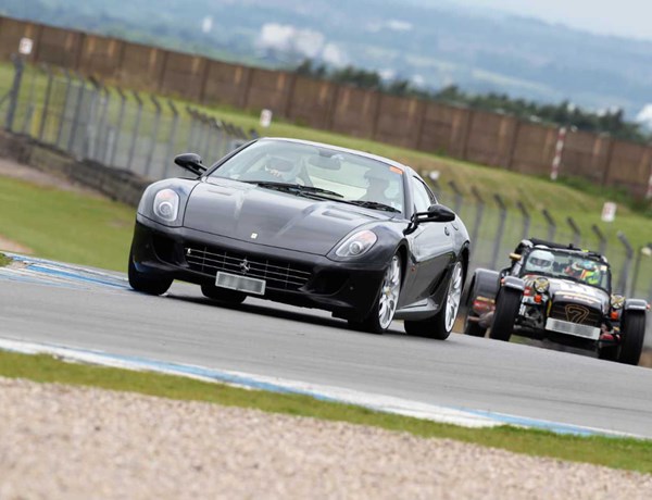 Black Ferrari And Caterham On Track Day