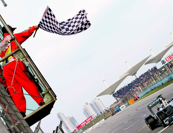 F1 Marshal Waving Chequered Flag