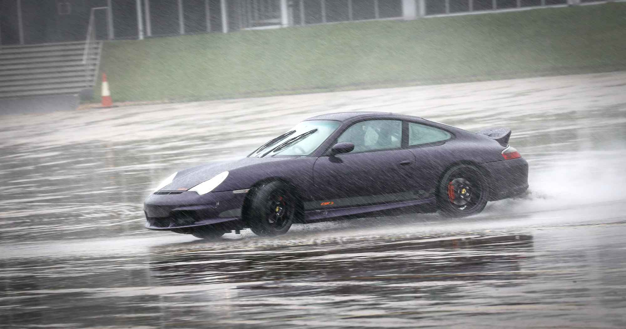 RPM Technik Porsche On A Wetted Skid Pad In The Rain