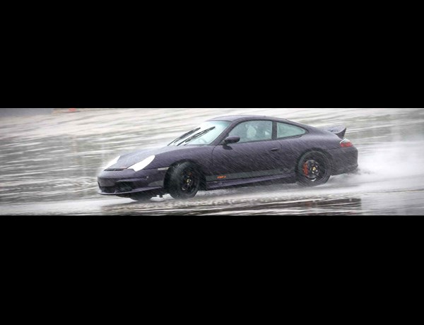 RPM Technik Porsche On A Wetted Skid Pad In The Rain